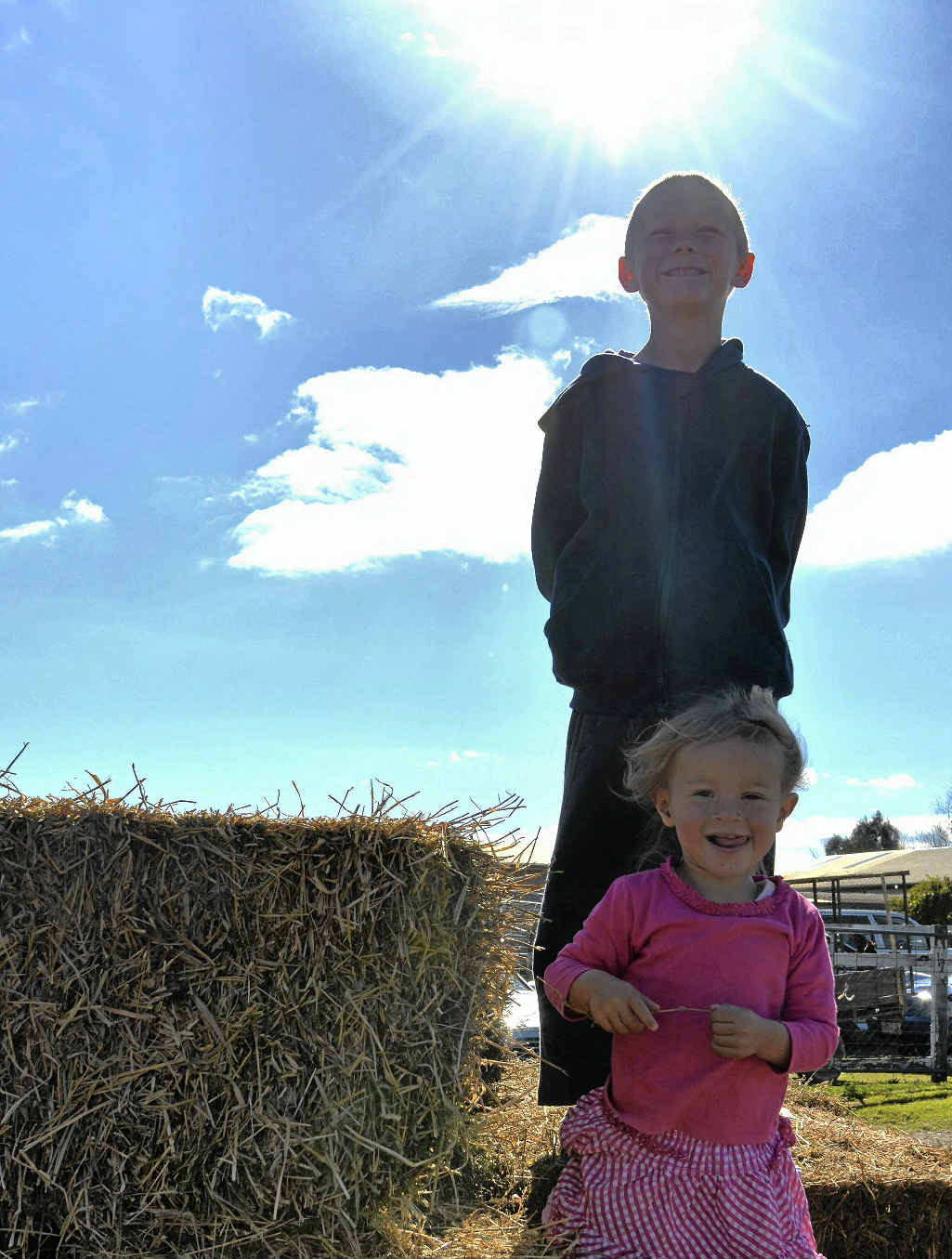 Natasha Burton, 3, and Andrew Milne, 7, enjoy the sunshine.